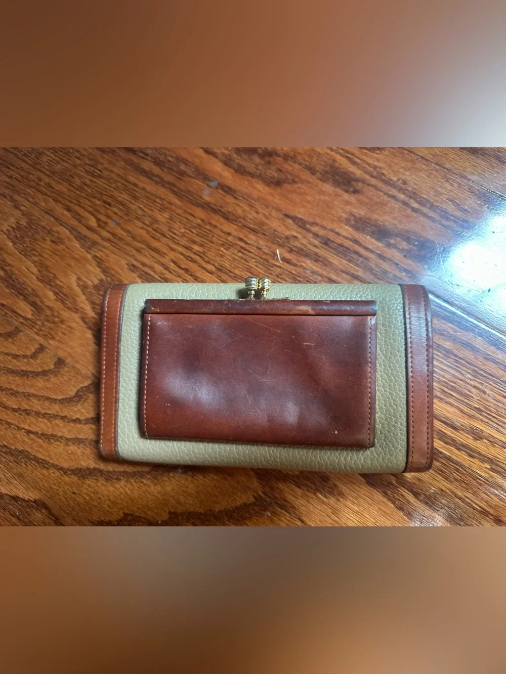 Dooney & Bourke Classic Pebbled Leather Wallet with Brown Trim